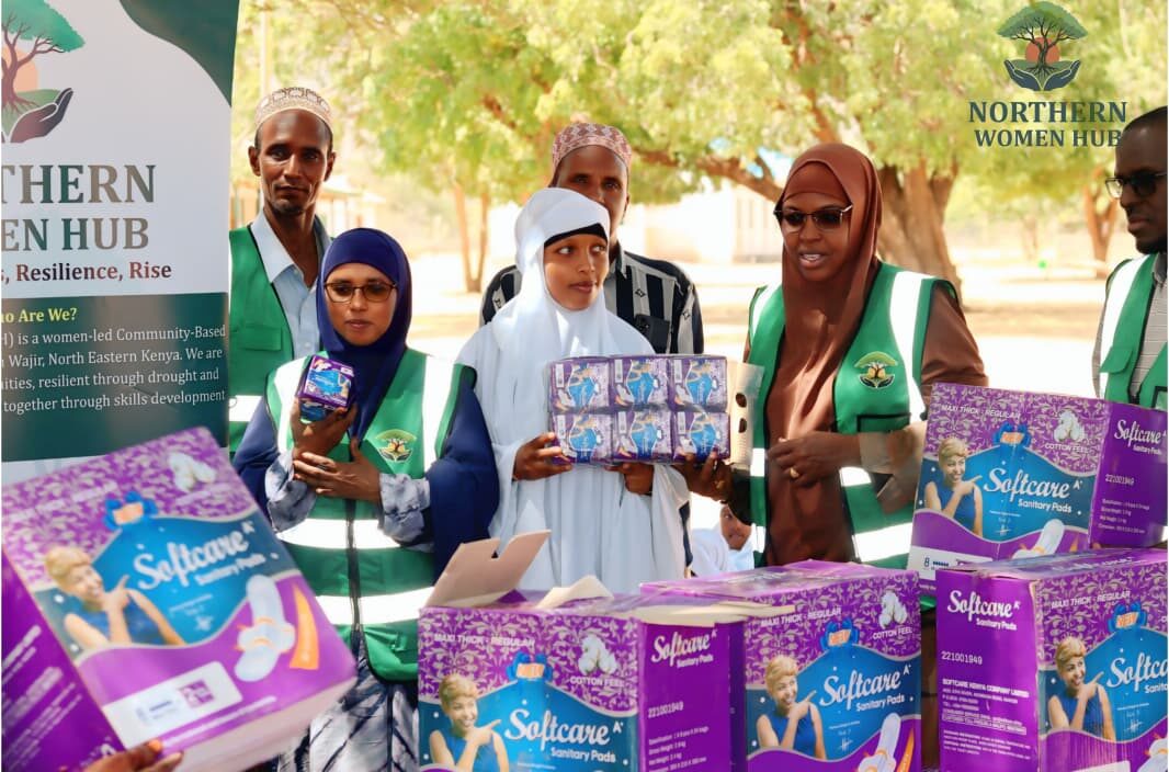 Northern Women Hub staff distributing sanitary pads to schoolgirls in Wajir